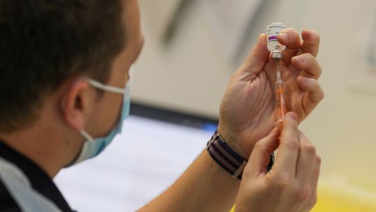 Anonymous Royal Navy medic preparing coronavirus vaccine at Bristol vaccination hub (Picture: MOD Crown Copyright).