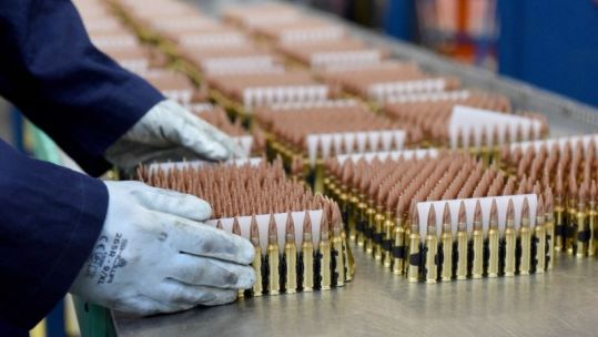 Anonymous hands moving munition at BAE Systems site Radway Green, Cheshire