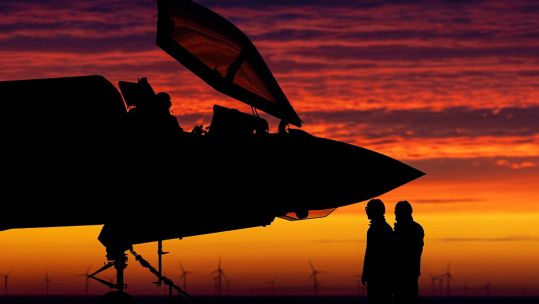 Anonymous personnel alongside an F-35B from 617 Squadron preparing for night flying training exercises whilst on Operation Achillean and deployed on HMS Queen Elizabeth