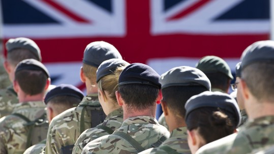 Anonymous troops with Union Jack CREDIT MoD