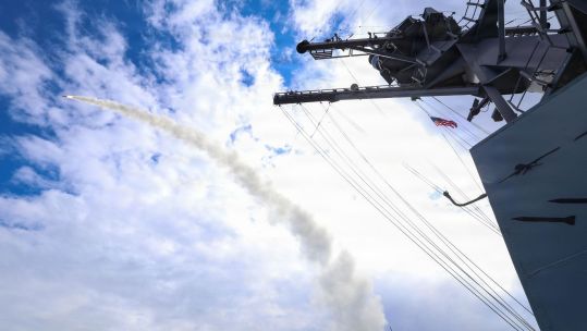Arleigh Burke-class guided-missile destroyer USS Thomas Hudner (DDG 116) fires a Tomahawk land attack missile