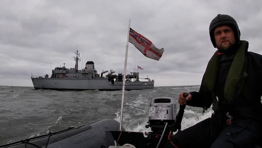 Armed Forces Day flag transported ashore from HMS Brocklesby