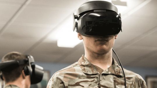 Cover Image: Service personnel trial the new virtual reality equipment (Picture: MOD).
