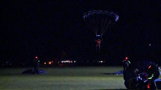 Army Tigers Parachute Display Team performs a night jump.