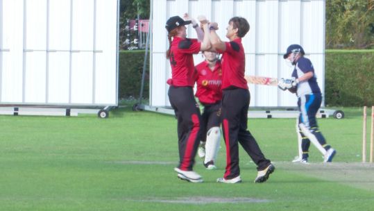Army women celebrate a wicket in their t20 cricket win over Aldershot.