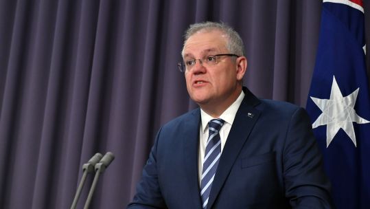 Cover image: Scott Morrison speaking at a press conference (Picture: PA).