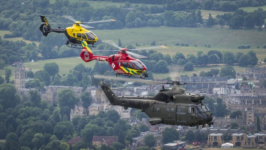 RAF and civilian helicopters fly together