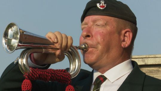 Barnsley bugler Paul Goose sounds the Last Post.