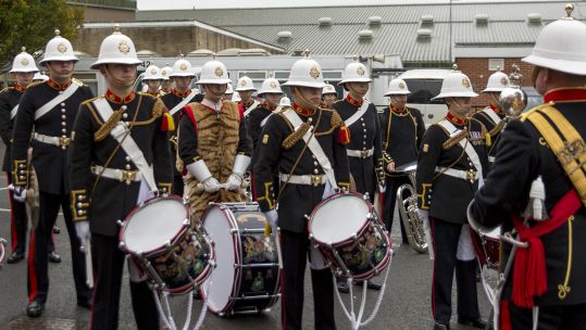 Bass Drummers of the Band Service of Her Majesty’s Royal Marines wearing tiger skins