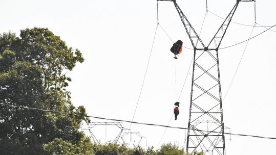 Belgian air force pilot caught on power line after ejecting from aircraft
