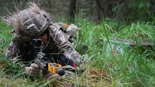 A soldier keeps watch with his SA80 L85A2 assault rifle