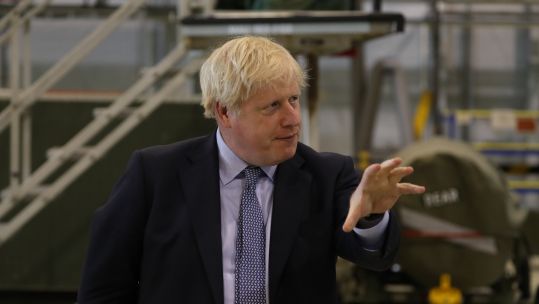 Boris Johnson at RAF Lossiemouth hangar (Picture: PA).
