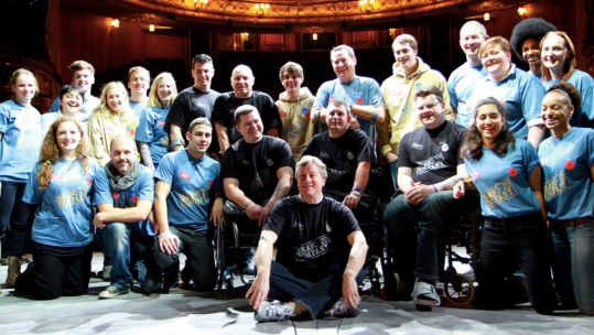 Bravo 22 Company participants pose for a photo on stage Picture Bravo 22 Company
