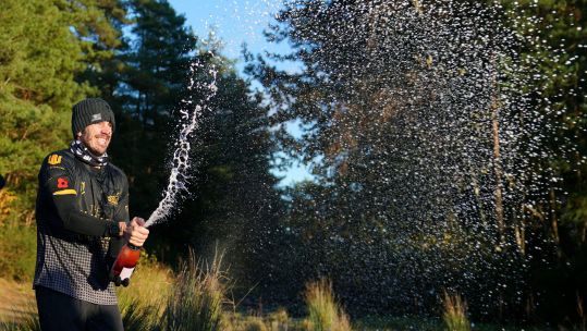 Brian Wood celebrates completing his Ultimate Sacrifice Challenge at Prince Philip Park in Surrey
