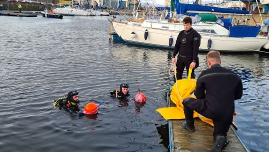 British Army divers recovering a sunken fishing boat in Lossiemouth Harbour 151221