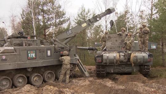 British Army tanks in Poland, alongside the REME's mobile tank repair shop