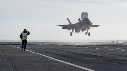Cover Image: A British F-35B lands on HMS Queen Elizabeth in UK waters for the first time (Picture: HMS Queen Elizabeth/Twitter).