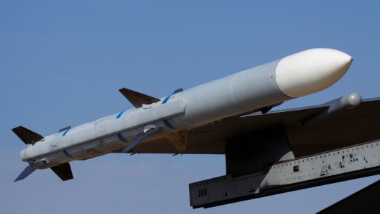 AIM-120 AMRAAM air-to-air missile on the wing of an F-16 fighter jet