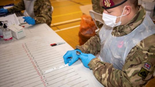 Soldier conducting lateral flow test