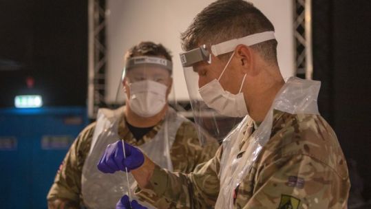 Personnel in Liverpool doing testing