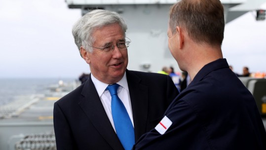 Sir Michael Fallon (left) with the Captain of HMS Queen Elizabeth, Jerry Kid (right).