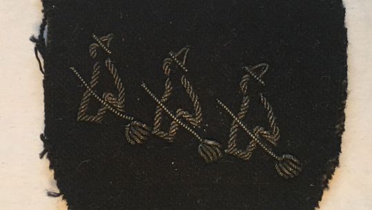CROPPED 16 x 9 Three Witches on Broomsticks emblem was used by Intelligence School 9, part of MI9, during their covert operations in Holland, 1944 CREDIT Dr Helen Fry