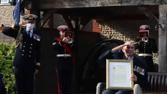 Cover image: Captain Knight receiving the framed letter written by the First Sea Lord (Picture: Royal Navy).