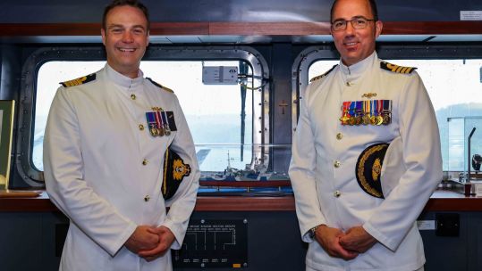 Captain Ian Feasey takes over from Captain Angus Essenhigh (right) as captain of HMS Queen Elizabeth 230921 CREDIT HMS QUEEN ELIZABETH, TWITTER