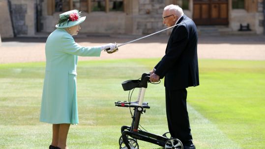 Cover image: The Queen knights Captain Sir Tom Moore during an investiture, just for the veteran, in July last year (Picture: PA).