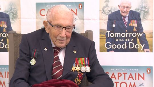 Captain Sir Tom Moore smiles as he speaks to Laura Makin Isherwood about his military career.
