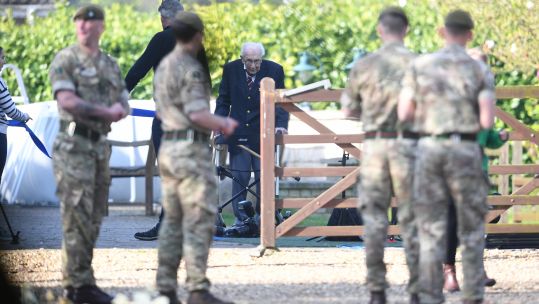 Captain Tom Moore completing 100th lap of his garden in Bedfordshire in April 2020 (Picture: PA)