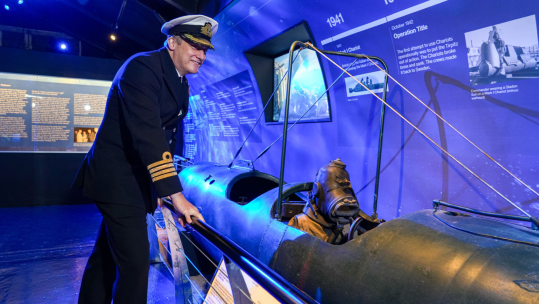 Captain, Captain Justin Codd admires a Human Torpedo