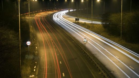 Car light trails at night on A38 in Derbyshire