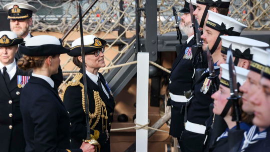 Cdre Jo Adey RN inspects the Guard of Honour, formed of sailors from Royal Navy Reserve units CREDIT ROYAL NAVY