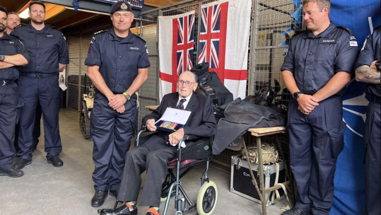Cdr Sean Heaton with Boyd Salmon and his replica medal collection 020125 CREDIT ROYAL NAVY