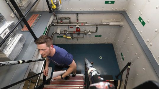 Cover image: Chef James Hopkinson climbs the stairs of HMS Queen Elizabeth (Picture: Royal Navy).