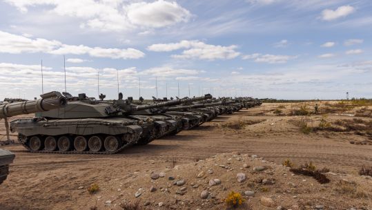 A line of 13 Challenger 2 main battle tanks line up on the Finnish training area during Exercise Arrow 22 in Finland in May 2022 (Picture: MOD / Crown Copyright).