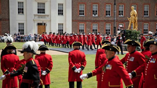 Chelsea Pensioners taking part in Royal Hospital Chelsea's Founder's Day parade at the hospital 