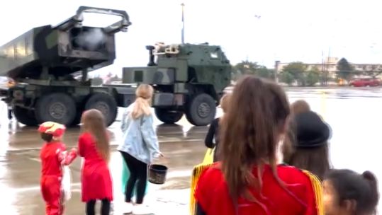 Children look for candy fired from a rocket launcher US Army Fort Sill (Picture: OfficialFtSill/Twitter).