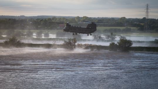 At the height of the operation, three RAF Chinooks were working on repairing the burst river banks (Picture: MOD). 