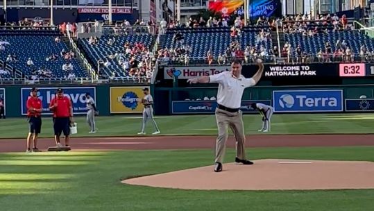 Screengrab from iPhone footage showing Col Paul Bates throwing the ceremonial first pitch before a Washington Nationals game CREDIT Crown Copyright
