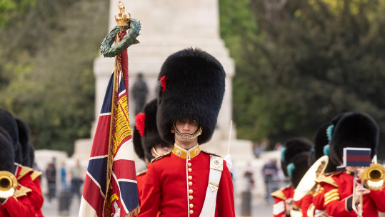 Coldstream Guards wearing Summer Guard Order military uniform scarlet and bearskin cap during Chief of Staff of US Army visit to London Whitehall 120422 CREDIT UK MOD © Crown copyright 2022.jpg