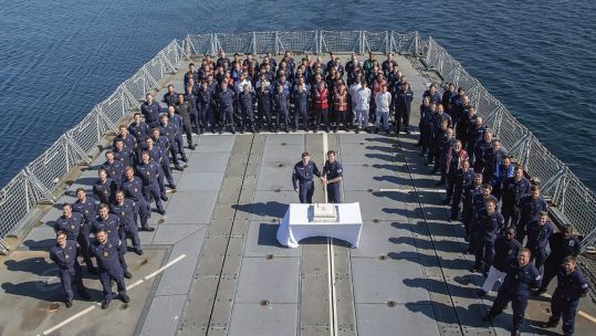 Commander Charlie Wheen and Hayden Jenkins cut the 30th birthday cake on the flight deck HMS ARGYLL 160621 CREDIT MOD.jpg