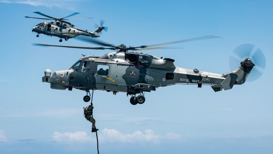 A sniper in a Merlin hovering overhead provided overwatch