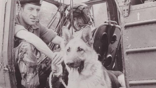 Corporal Bryan Criddle and helicopter pilot Sergeant Stan Richie with army dog Jason in Northern Ireland 23072023 NO REUSE CREDIT PA WIRE, PA IMAGES