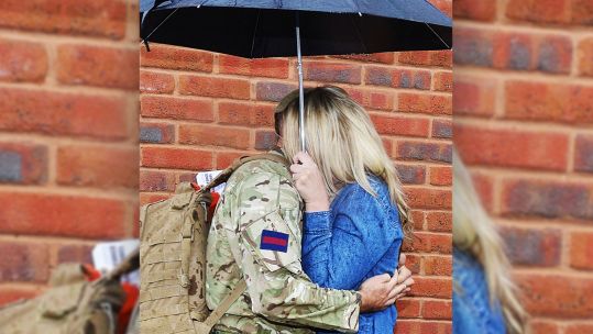 Couple Hugging Embracing Umbrella Uniform Brick Wall Picture Crown Copyright