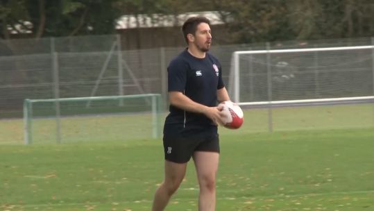 Craig Monaghan playing rugby.