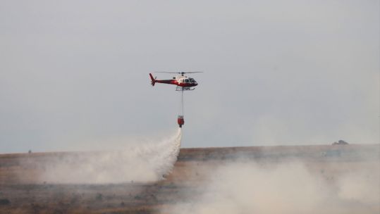 Salisbury Plain Training Area fires extinguished by helicopter dropping water on the areas affected CREDIT Tim Jalland