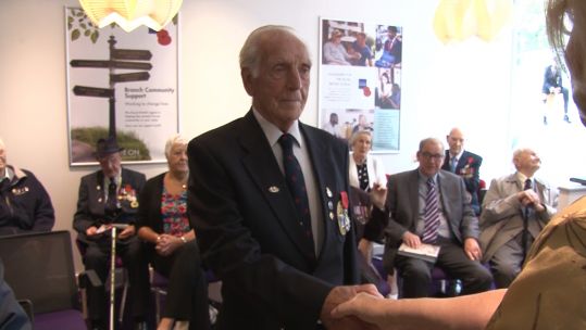 Veteran Fred Hill receives his Legion D'honneur medal during the event.