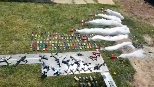 Martin Brigde and his family created an airshow in their garden using aircraft models and sound recordings. CREDIT: Martin Bridge